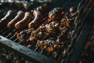 a bunch of food is cooking on a grill