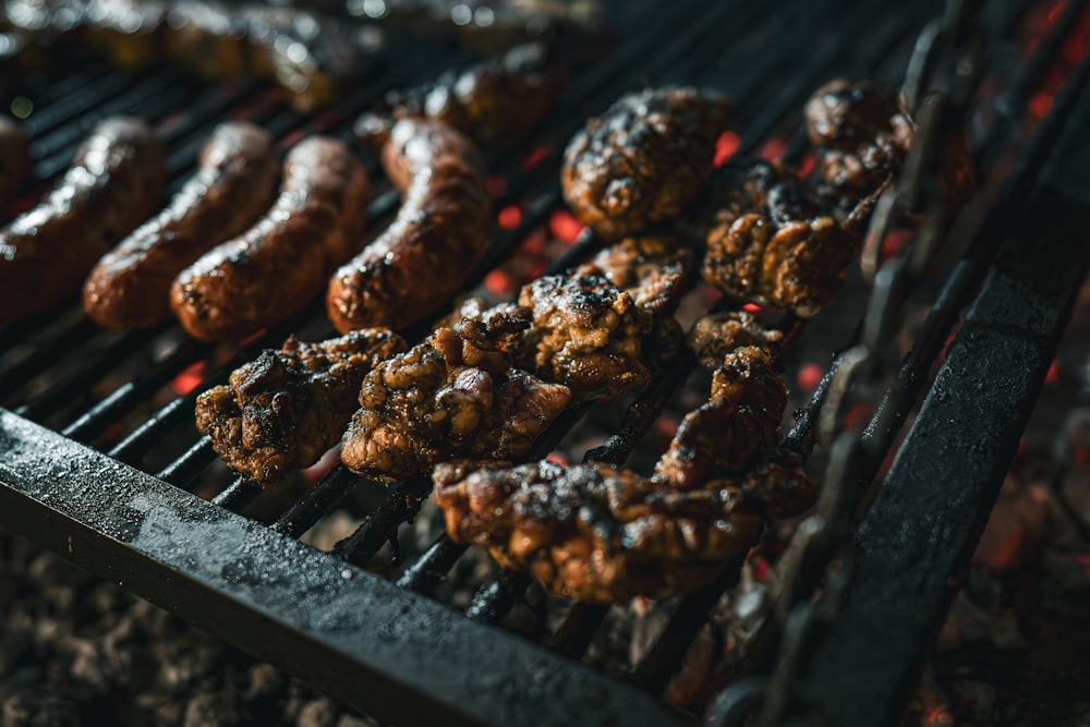 a bunch of food is cooking on a grill