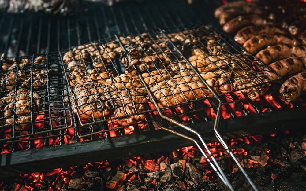 a close up of food cooking on a grill