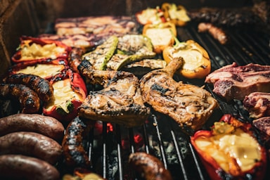 a bunch of food is cooking on a grill