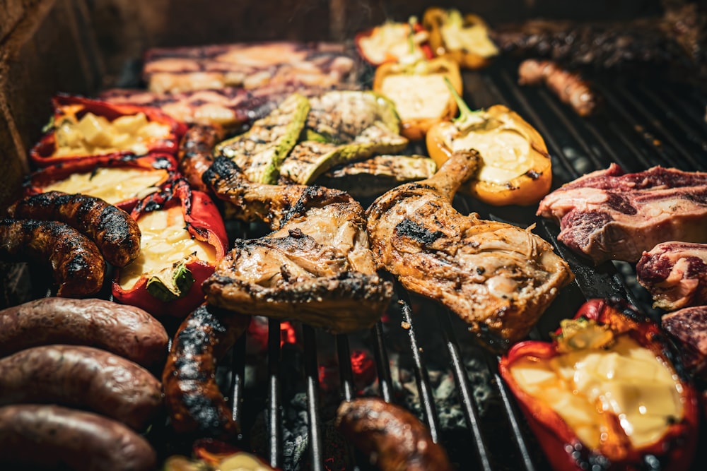a bunch of food is cooking on a grill