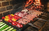 a bunch of food that is on a grill