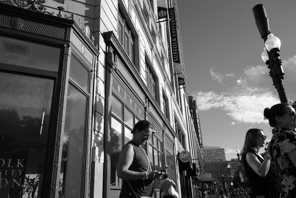 a man and a woman standing on a street corner