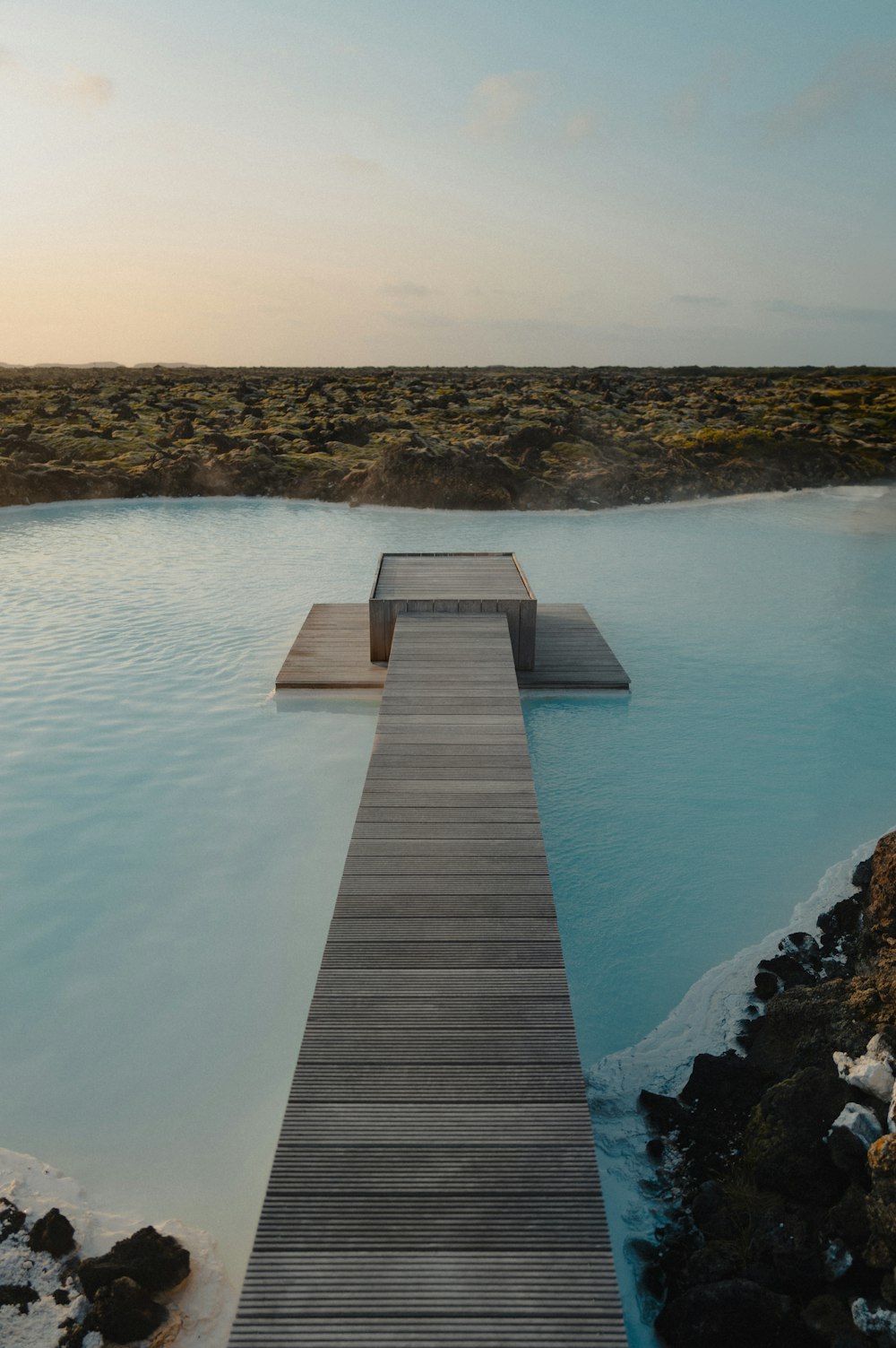 a dock that is next to a body of water