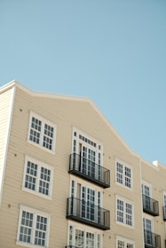 Close-up of a renovated apartment exterior featuring clean lines and navy blue trim.