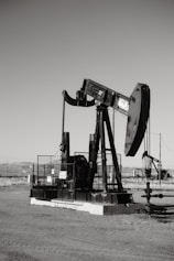 a black and white photo of an oil pump