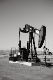 a black and white photo of an oil pump