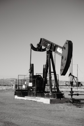 a black and white photo of an oil pump