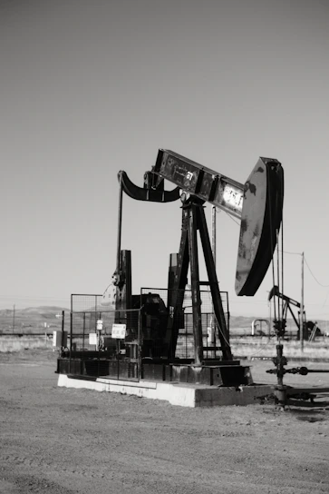 a black and white photo of an oil pump