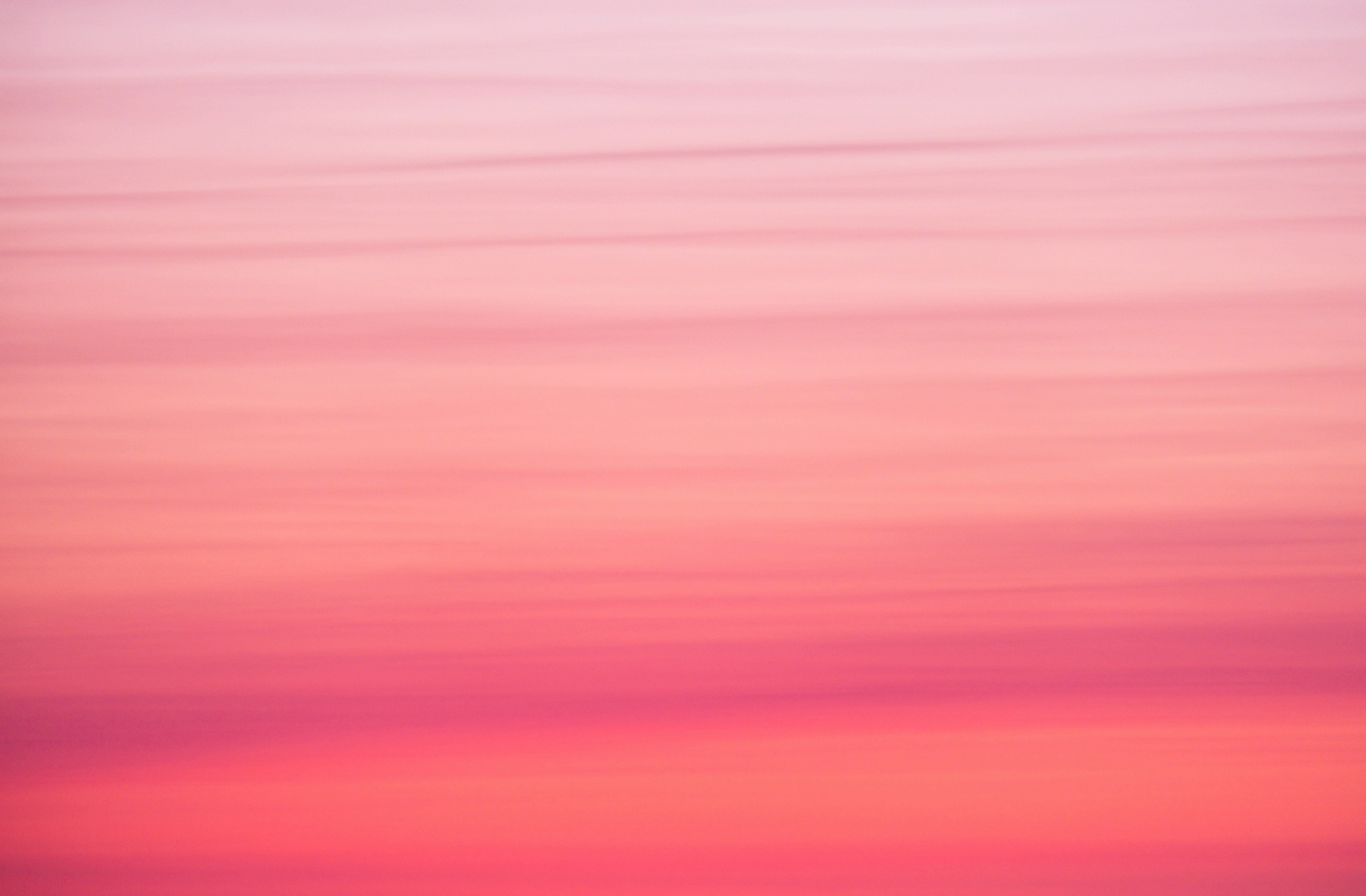 Pink and blue sky with plane