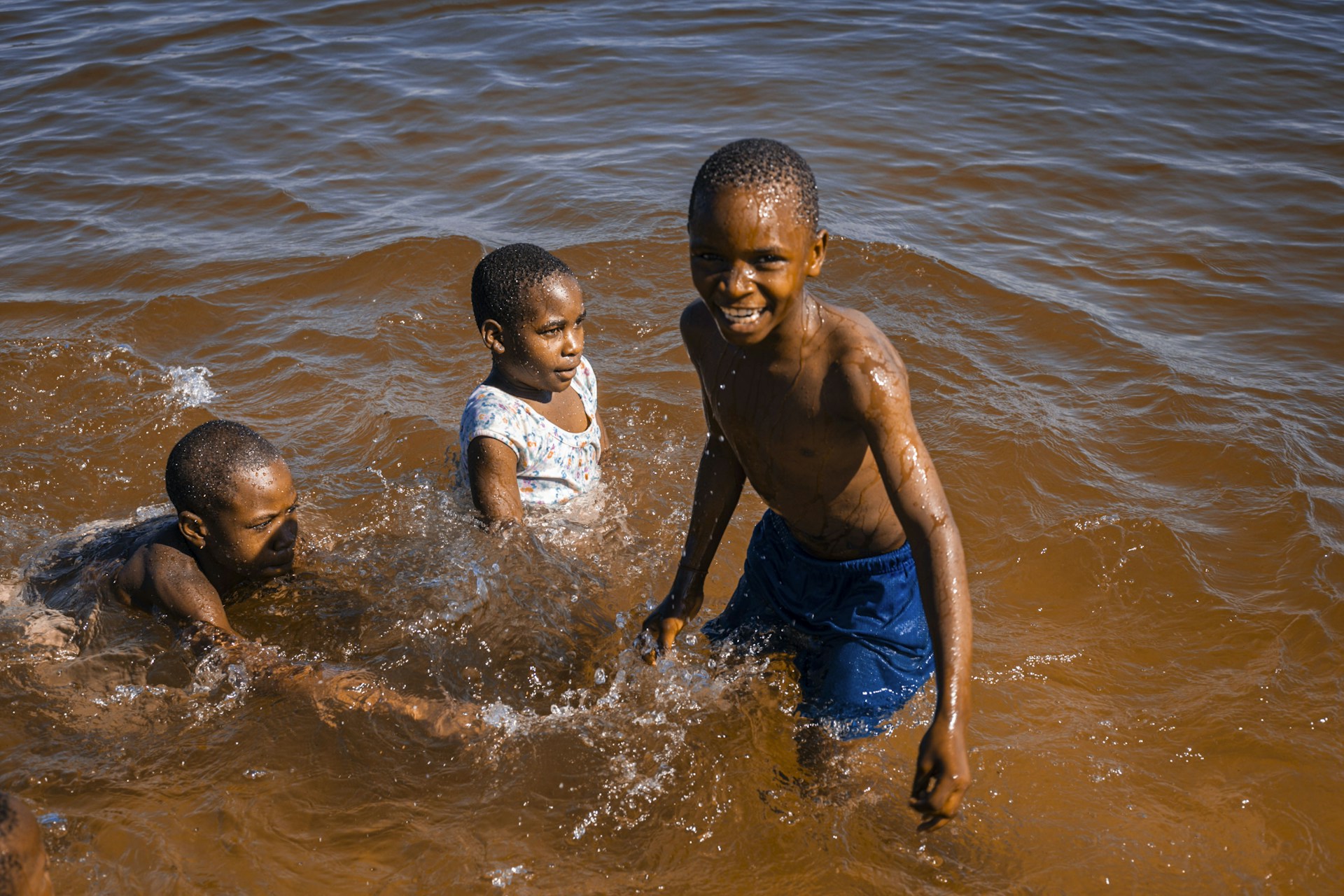 woman wearing yellow long-sleeved dress under white clouds and blue sky during daytime