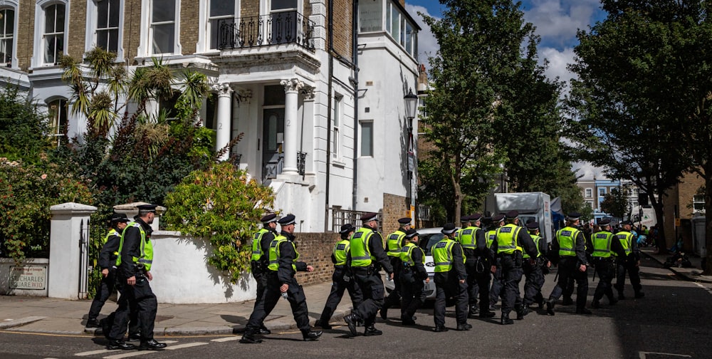 a group of police officers walking down a street