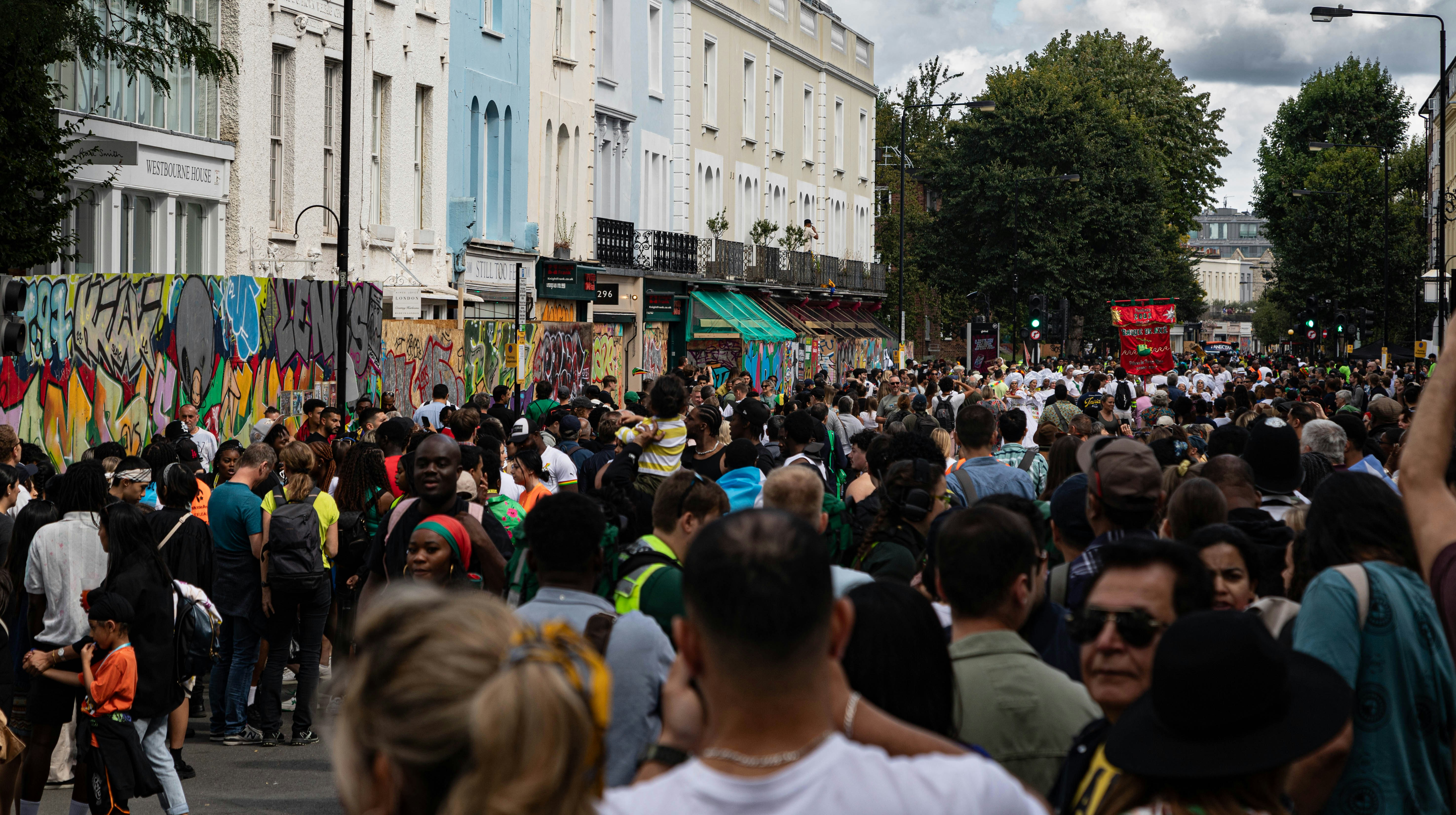 a large group of people walking down a street