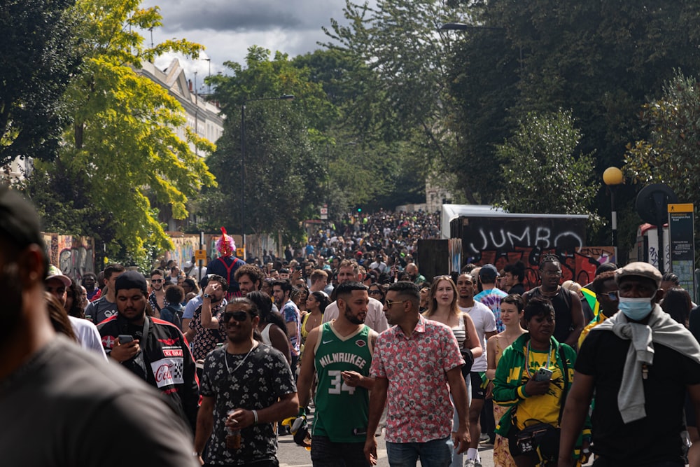 a large group of people walking down a street