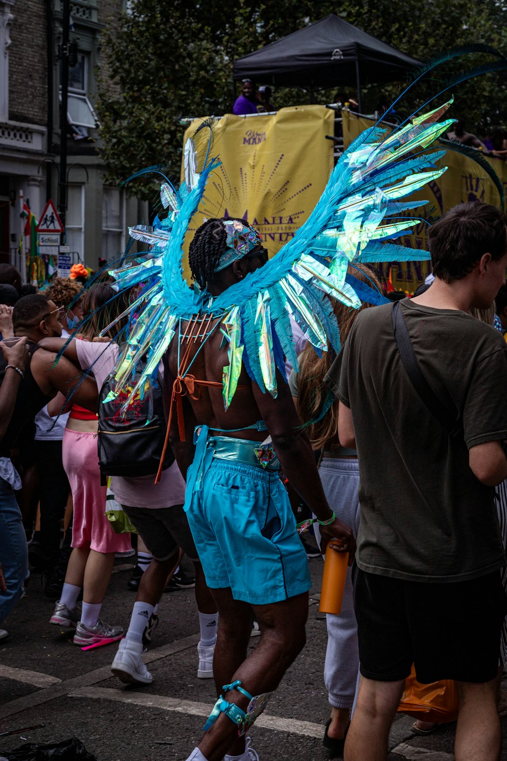 a man in a costume walking down a street