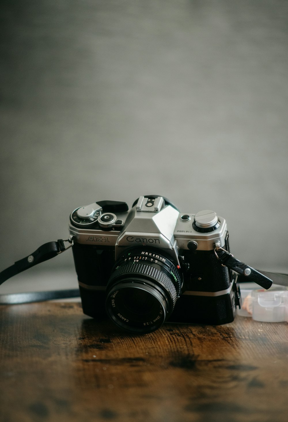 a camera sitting on top of a wooden table