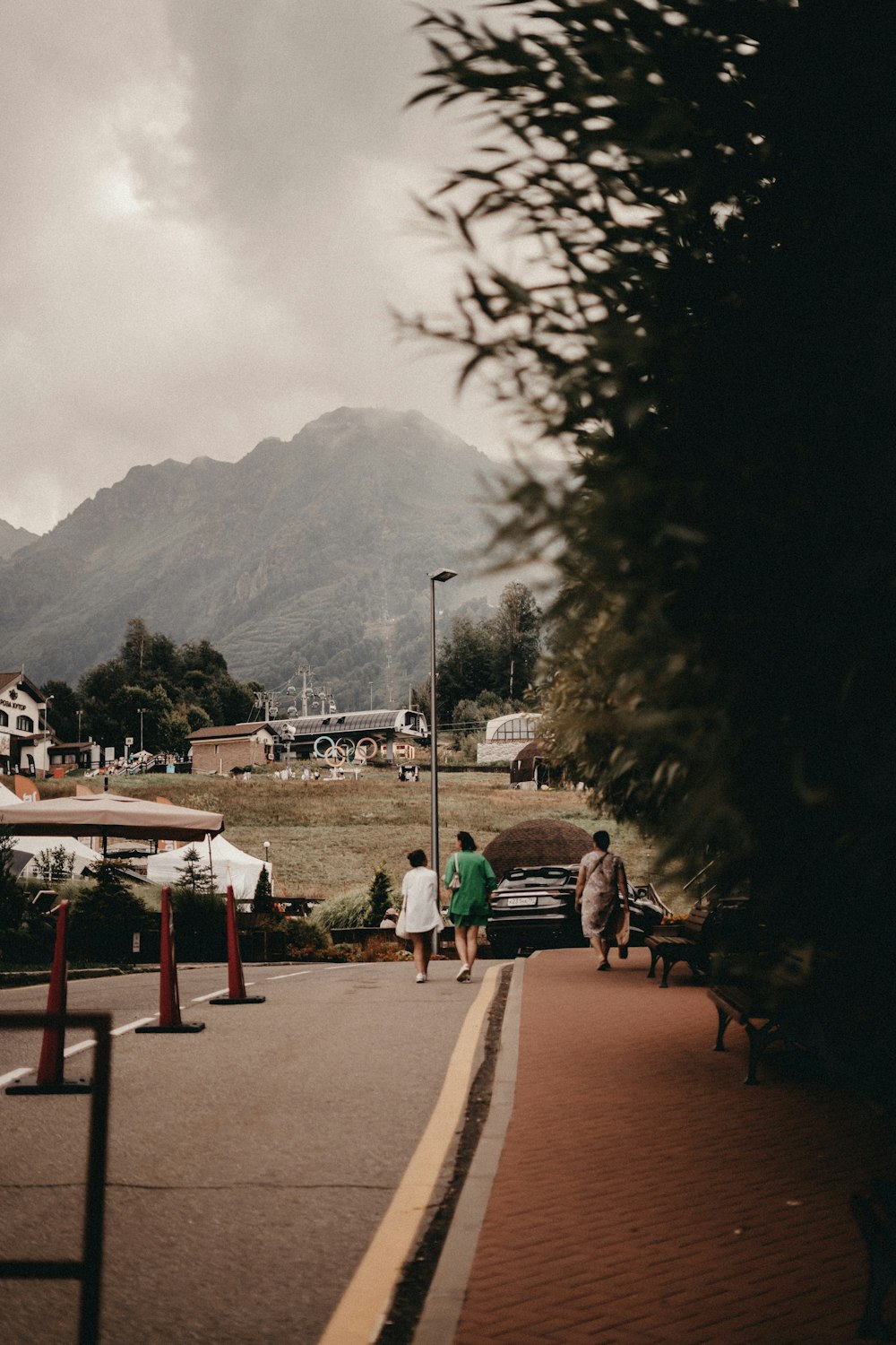 a couple of people that are walking down a street