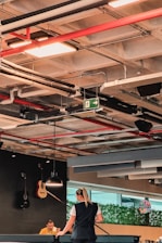 a woman and a child playing a game of ping pong