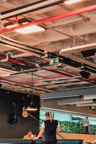 a woman and a child playing a game of ping pong