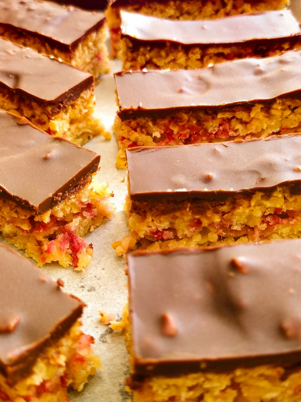 a bunch of pieces of cake that are on a table