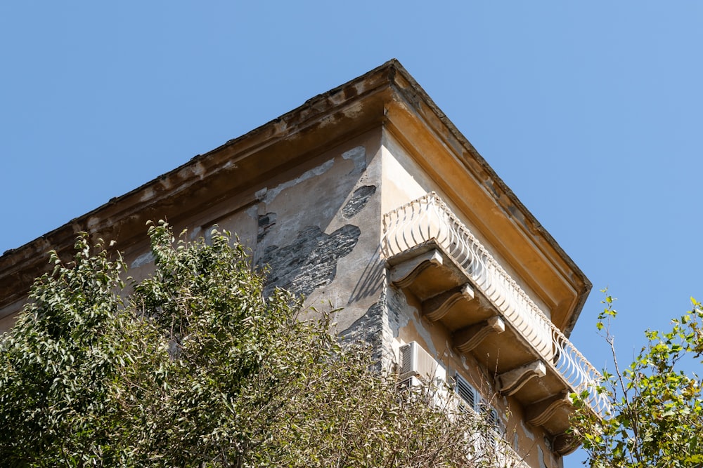 a tall building with a balcony and balconies