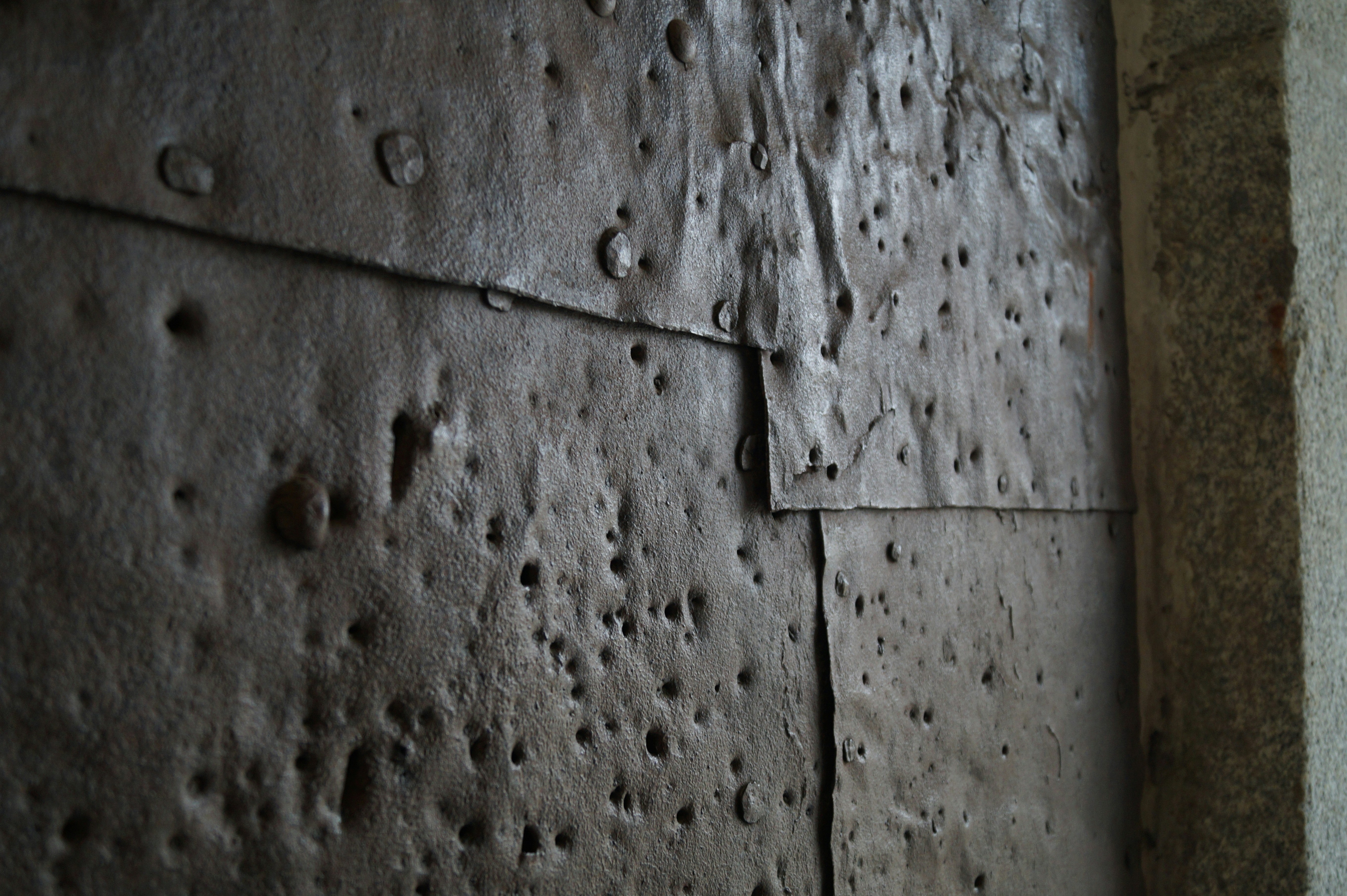 a close up of a wall with water drops on it