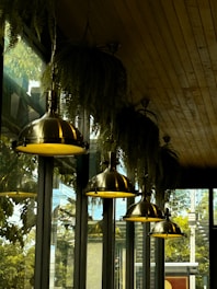 a row of lights hanging from the ceiling of a restaurant