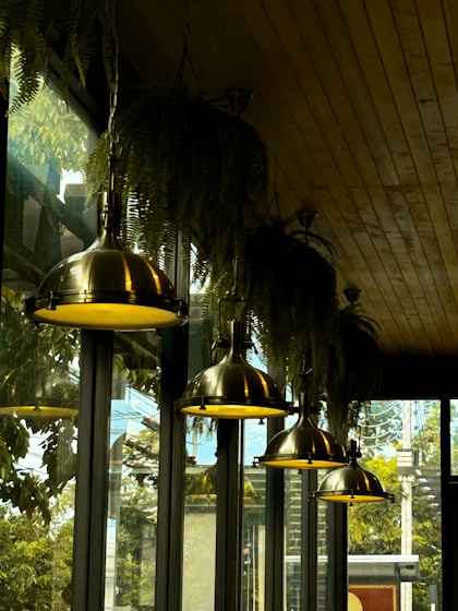 a row of lights hanging from the ceiling of a restaurant