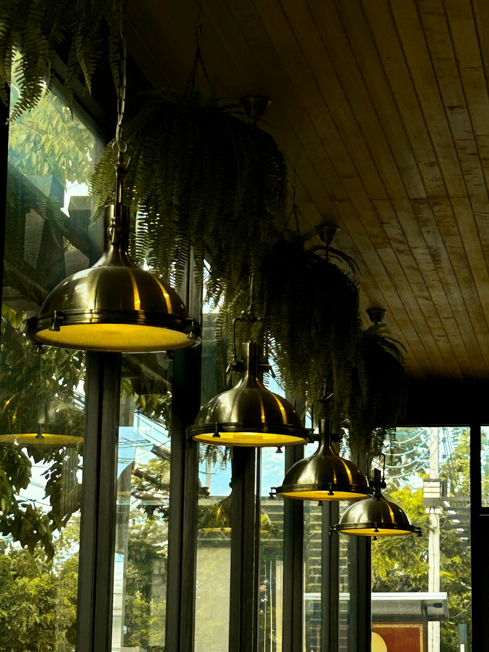a row of lights hanging from the ceiling of a restaurant