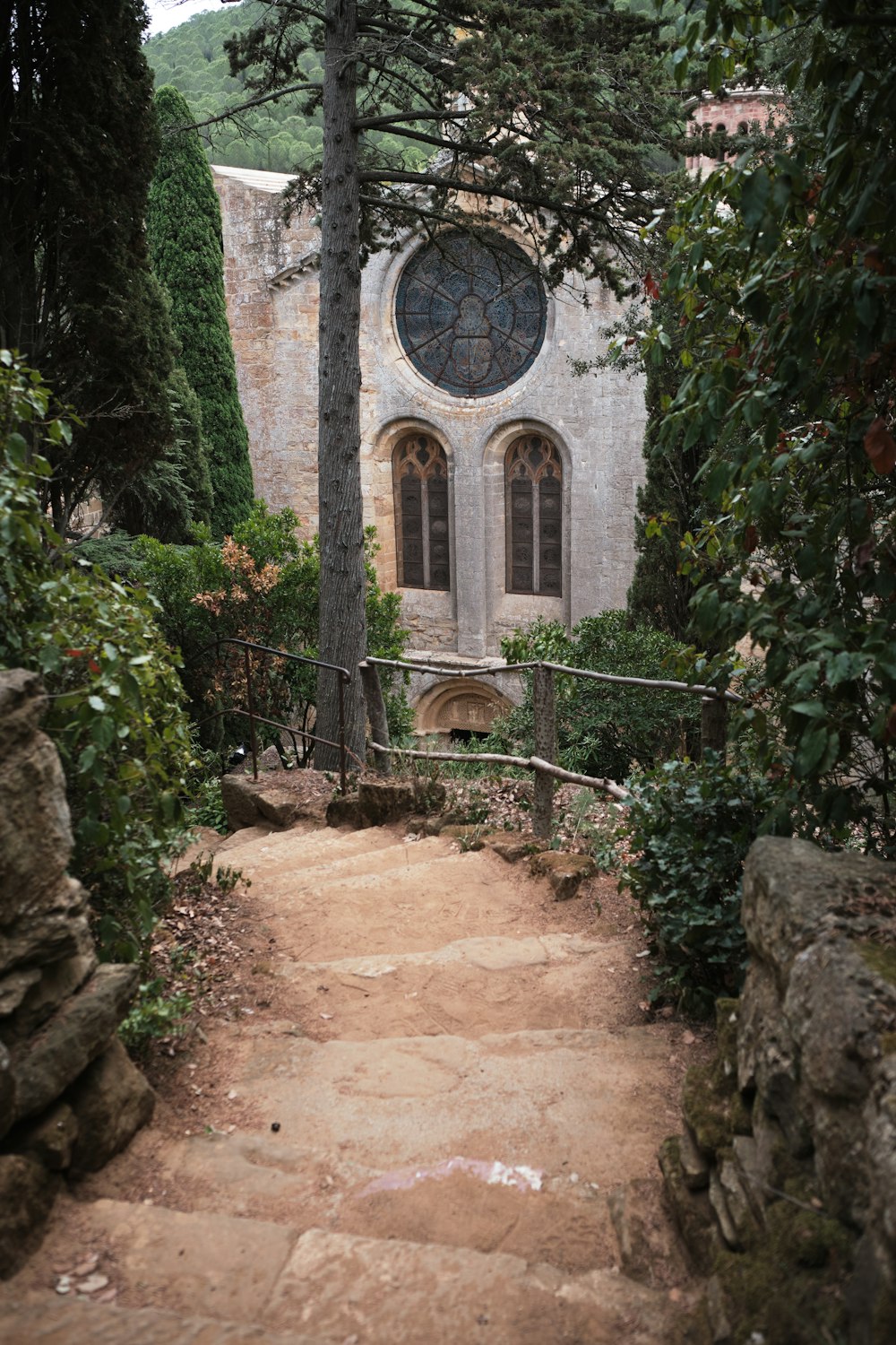 a stone path leading to a stone church