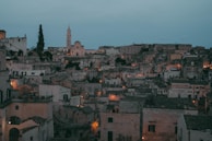 A scenic view of a historic English town with cobblestone streets and old buildings.