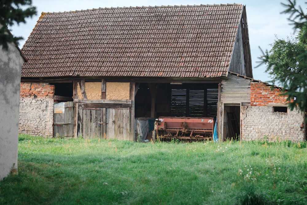 an old barn with a broken down door