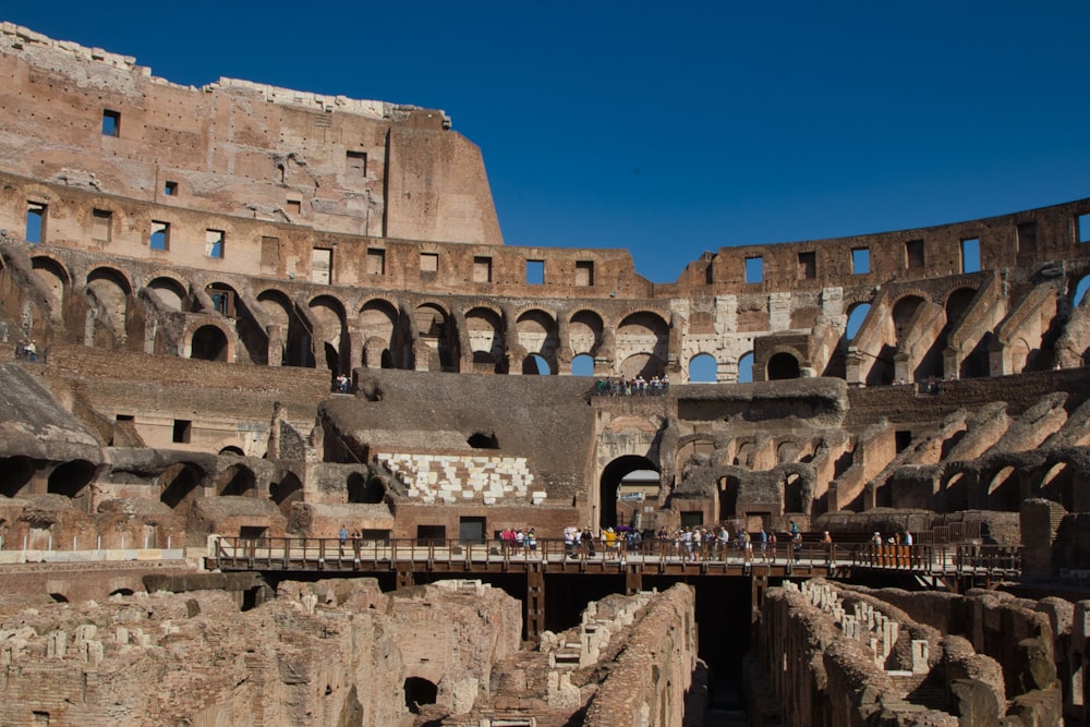 a group of people standing inside of a large building