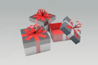 Close-up of elegant corporate gift boxes with ribbons and branded items inside.