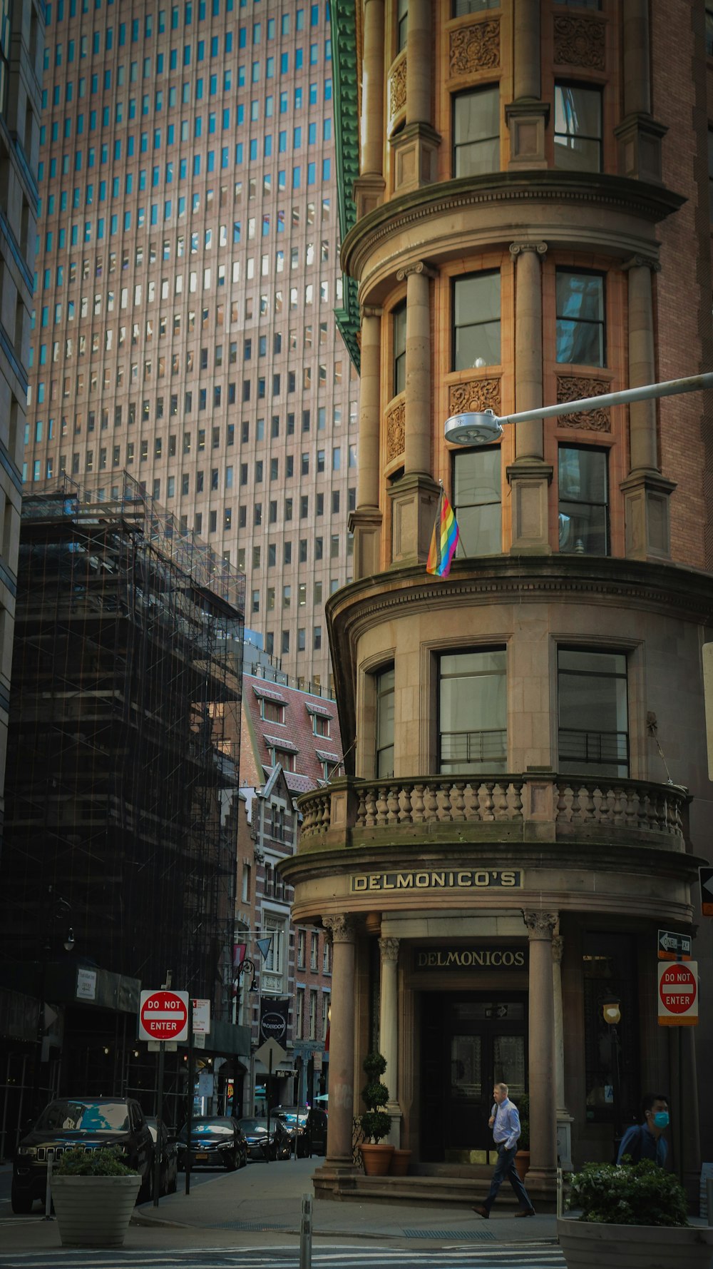 a tall building with a rainbow flag on top of it