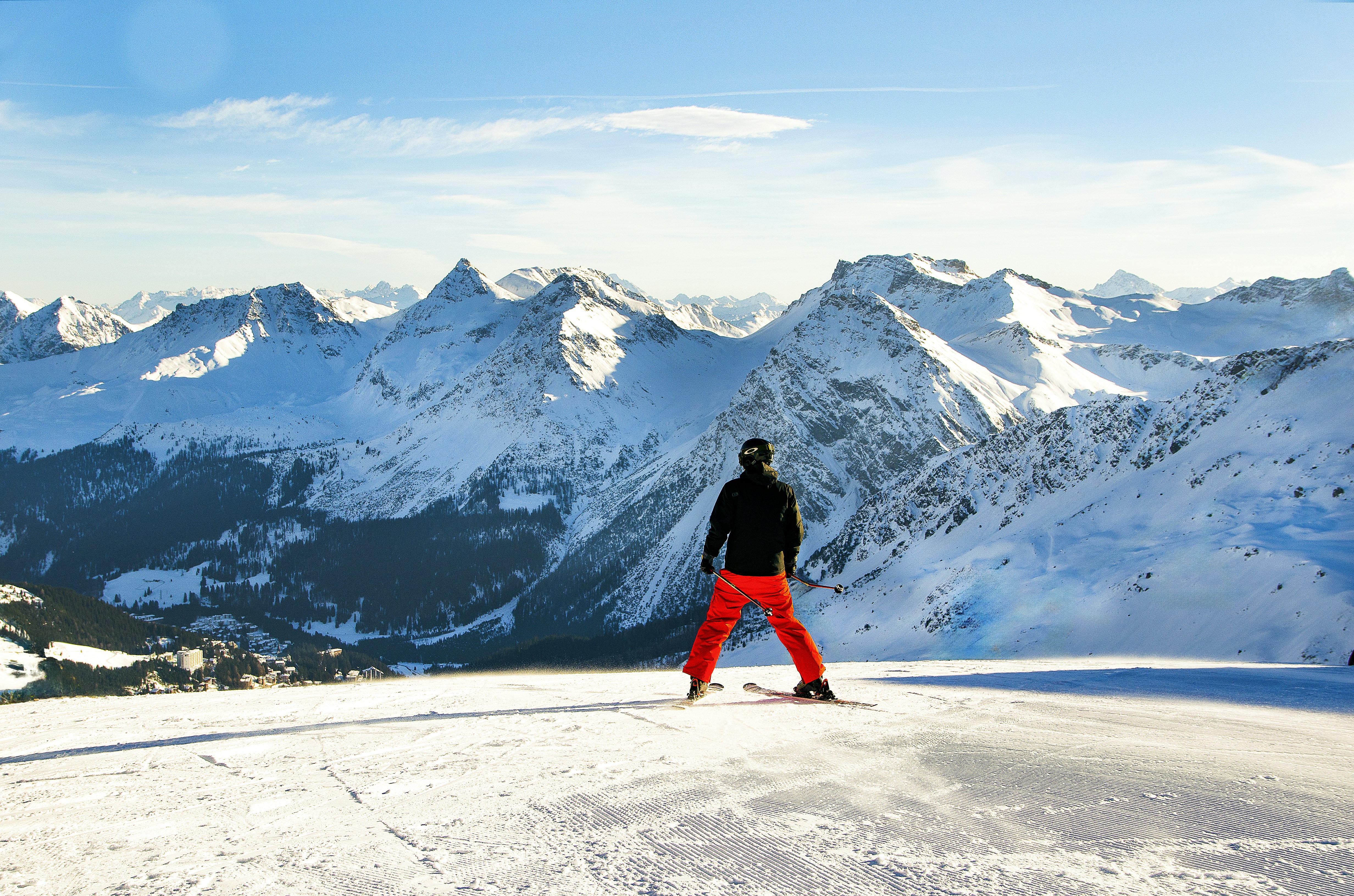 a man standing on top of a snow covered slope, Skier on Hornli