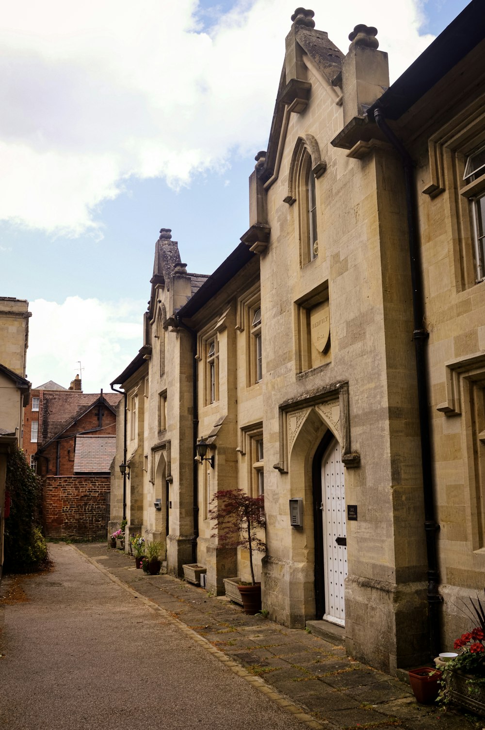 a row of old buildings with a white door