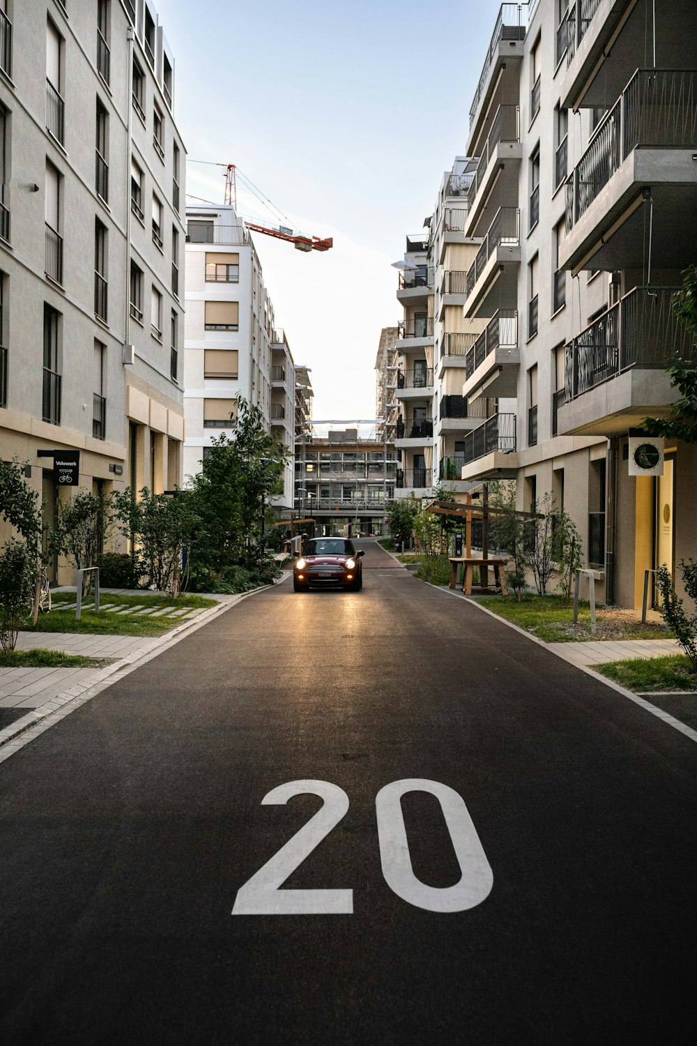 a car is parked in the middle of an empty street