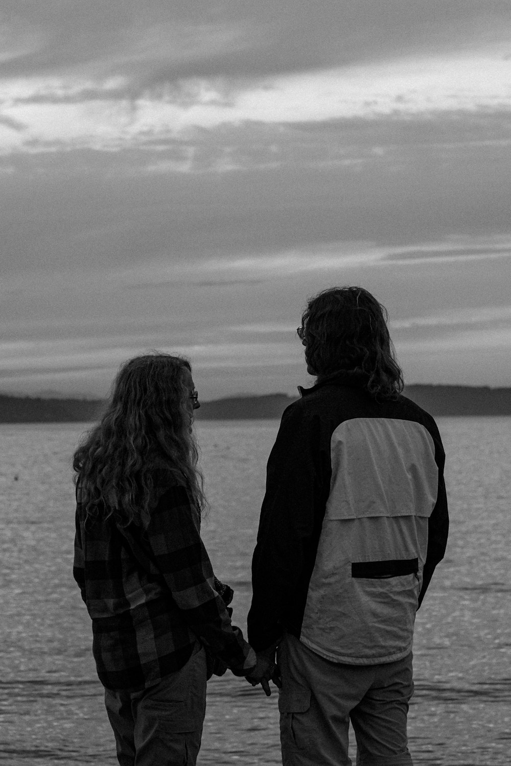 a man and a woman standing next to each other