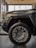 An image featuring a selection of colorful car wheels neatly displayed in a showroom.