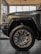 An image featuring a selection of colorful car wheels neatly displayed in a showroom.