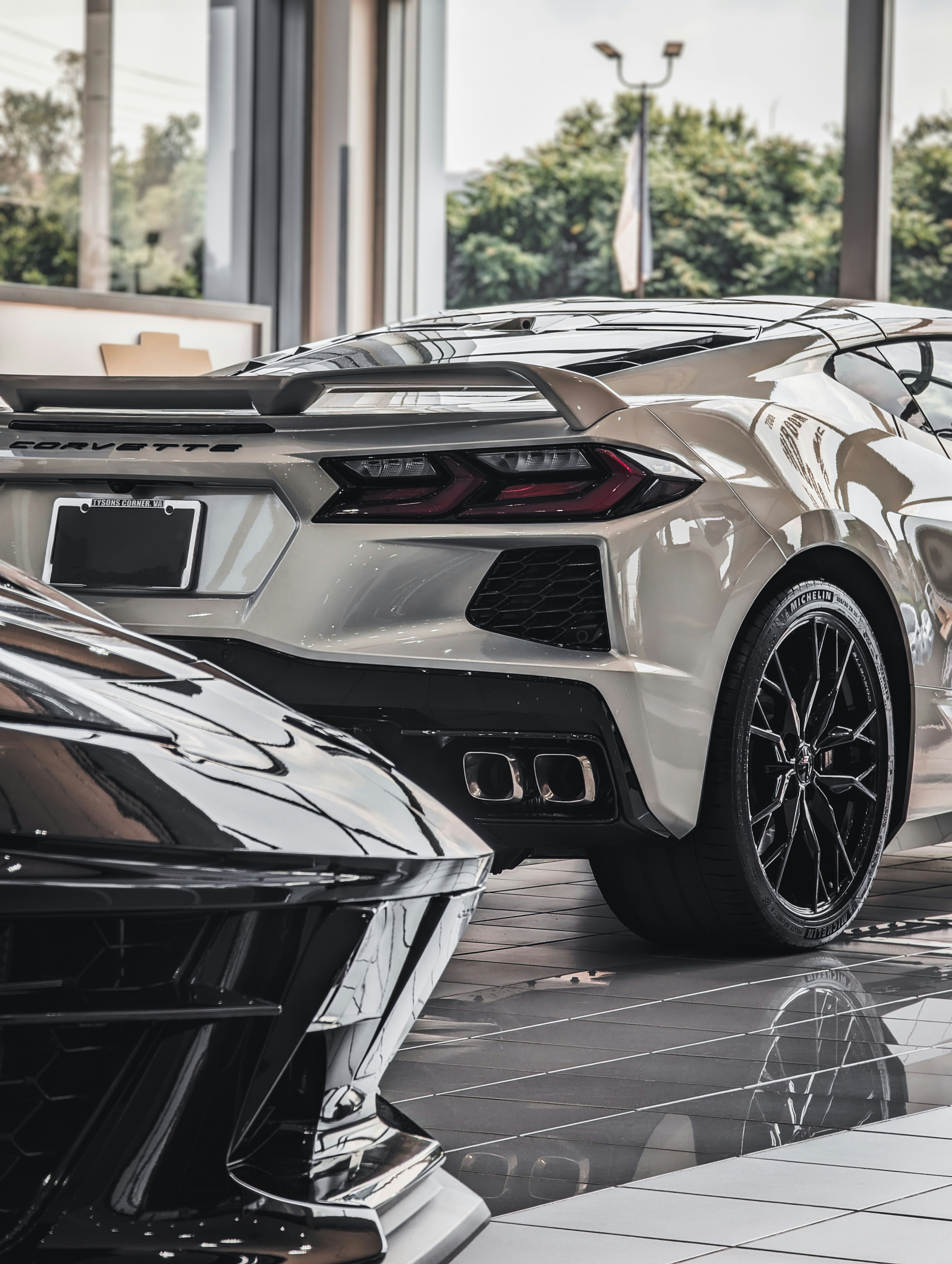 a white sports car parked in front of a building