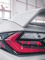 Rear shot capturing the sleek aerodynamic rear spoiler with subtle lighting.