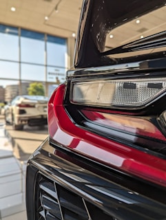 A set of tail lights arranged neatly, showcasing the variety available for UK and France markets.