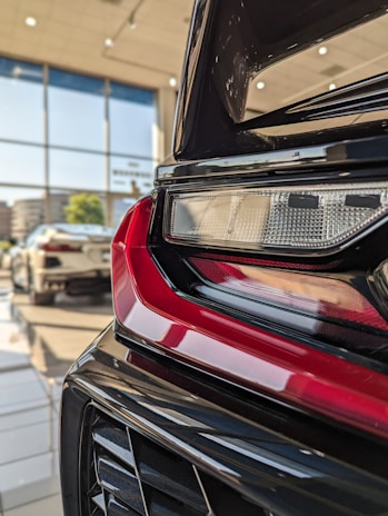 A set of tail lights arranged neatly, showcasing the variety available for UK and France markets.