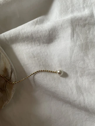 Elegant golden accents glowing softly in a minimalist memorial space with warm lighting.