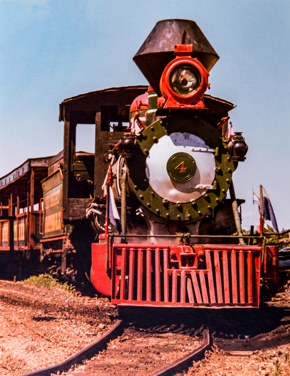 an old train engine sitting on the tracks