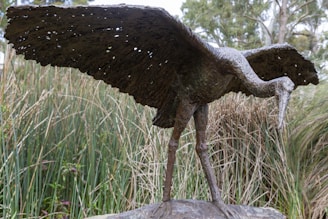 Close-up of a bronze sculpture capturing African wildlife in motion