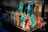 Several test tubes filled with various colored liquids are arranged in a clear test tube rack. The liquids display a range of vibrant colors including orange, blue, turquoise, and red.