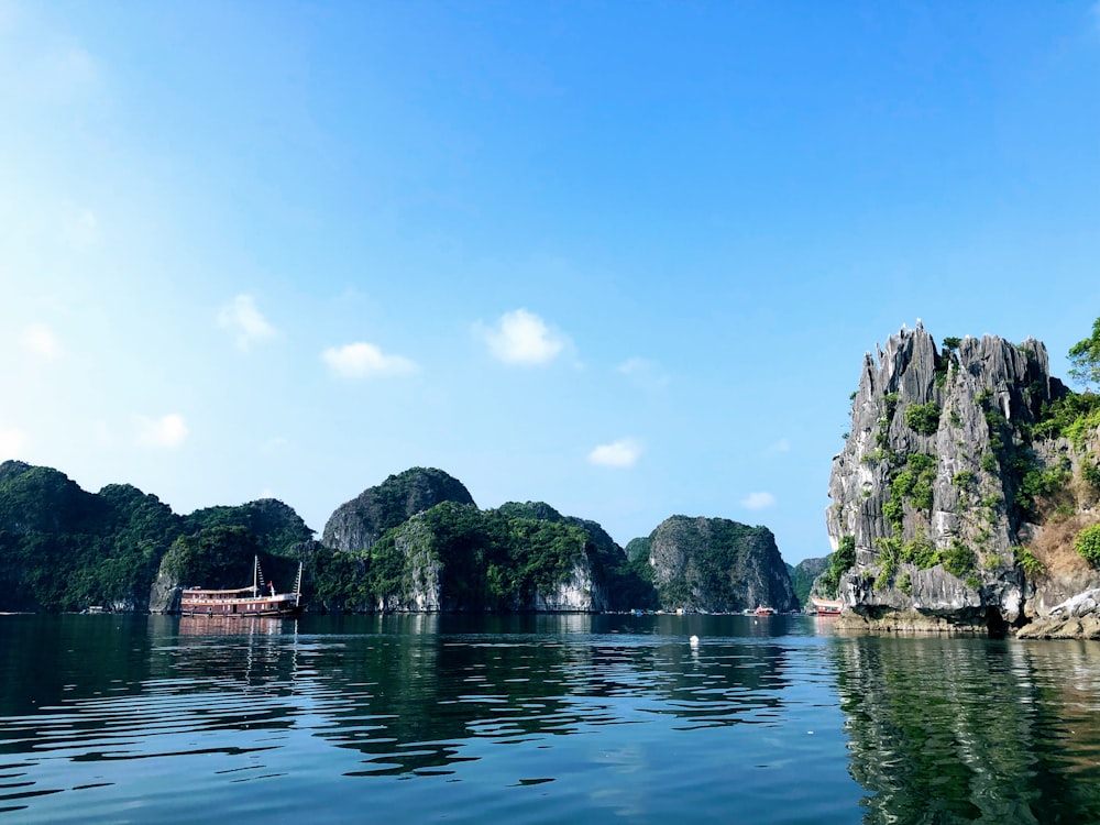 a body of water surrounded by mountains and trees